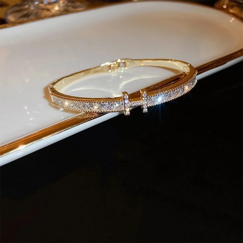 3 Bracelet-Gold Letter H.