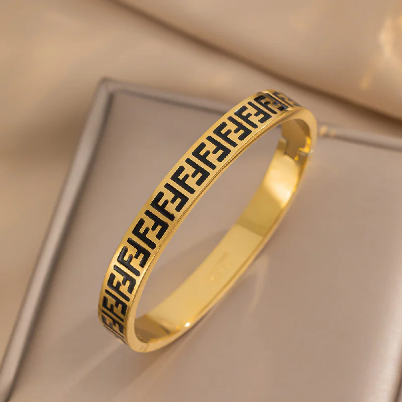 180 gold+black lettered bracelet